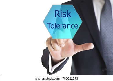 Businessman Hand Writing Risk Tolerance On A Transparent Wipe Board