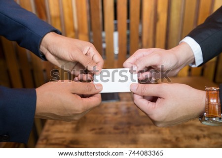 Businessman handing business card. Exchange business card for first time meet. For success business concept.