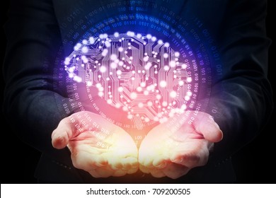 Businessman hands holding abstract circuit brain on dark background. Artificial intelligence concept 