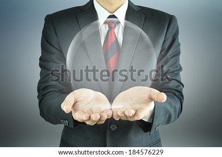 Businessman hands holding empty transparent sphere 