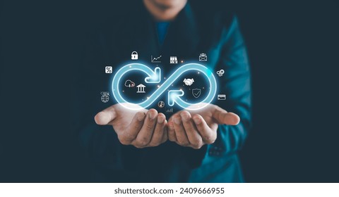 Businessman Hands holding virtual infinity with technology marketing online icon, a symbol of connection to community metaverse world network system and Technology data link concept.