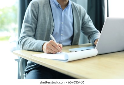 Businessman hands pointing at business document. Closeup. - Shutterstock ID 667635436