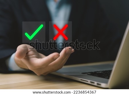 Businessman hands showing checks marks and wrong The idea is to decide to vote. think yes or no Business options for difficult situations true and false symbols