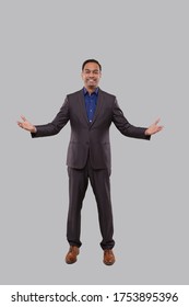 Businessman Hands To Sides Welcome Gesture Isolated. Indian Businessman Standing Full Length