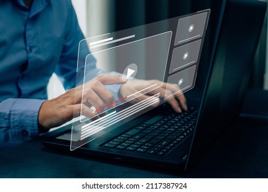 Businessman hands using laptop for streaming online, watching video on internet. - Shutterstock ID 2117387924