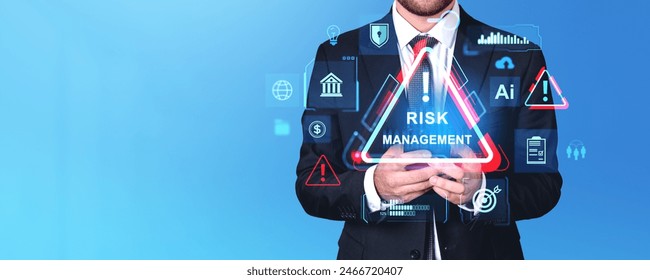 Businessman hands using phone, virtual screen with risk management icon and glowing diverse banking or marketing symbols. Copy space. Concept of business safety and research - Powered by Shutterstock - Get 15% off with code: PIKWIZARD15