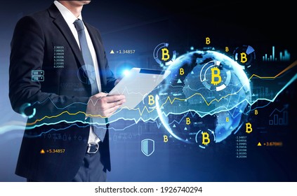 Businessman hands using tablet researching a business report of cryptocurrency market behaviour based on worldwide news. Business and financial success concept. double exposure.