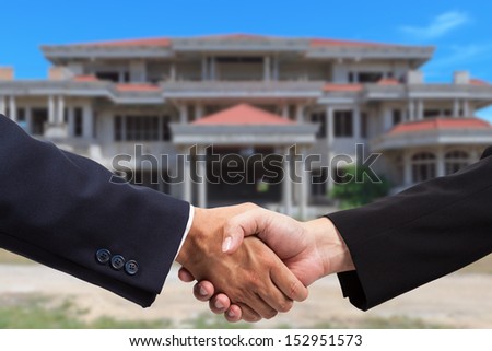 Businessman handshake for real estate business