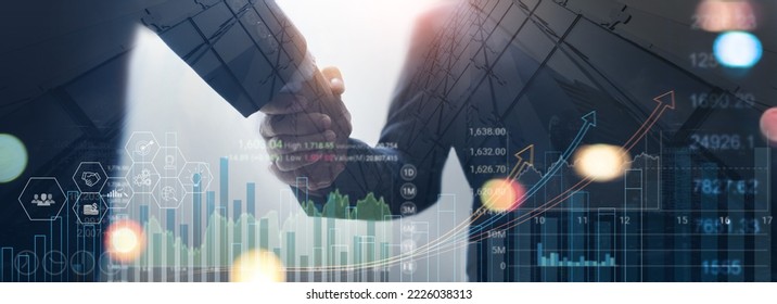 Businessman handshake for successful investment deal with economic growth graph chart, sales data and market report, global network business deal, strategy and digital marketing concept - Powered by Shutterstock