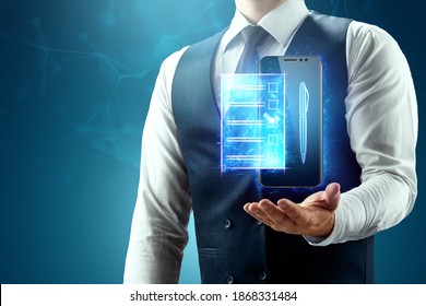 The Businessman Has A Blue Hologram Of The Contract In The Palm Of His Hand. Concept Of Electronic Document Circulation, Electronic Signature, Online Cooperation. Mixed Environment