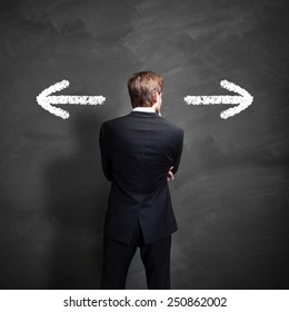 Businessman Has To Decide Between Two Directions