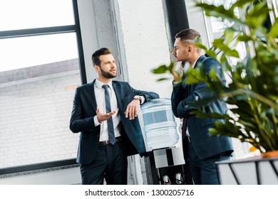 businessman having discussion with coworker in modern office - Powered by Shutterstock