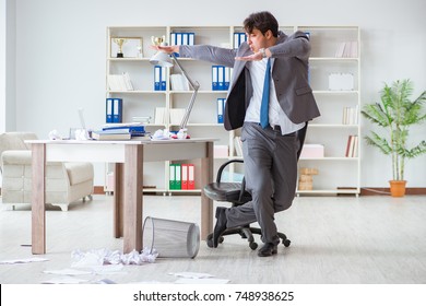 Businessman Having Fun Taking A Break In The Office At Work