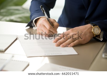 Businessman having signatory right signing contract concept, focus on male hand putting signature on official legal document, entering into commitment, concluding business agreement, close up view