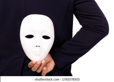 Businessman Hide White Mask Behind Back. White Collar Worker Is Dishonest Cheating. Faking And Betray Business Partnership, Dishonest Hiding In Mask. Cheating Person Hiding Mask. Pretend Good Person