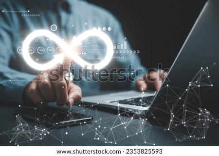 Businessman highlights infinity symbol, signifying limitless connection in data technology. Cyber space, future unlimited. Infinite power, energy, internet information. technology infinity data