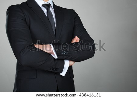A businessman with his arms crossed