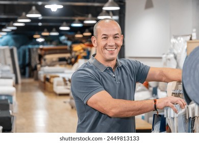 A businessman in his mattress store. - Powered by Shutterstock