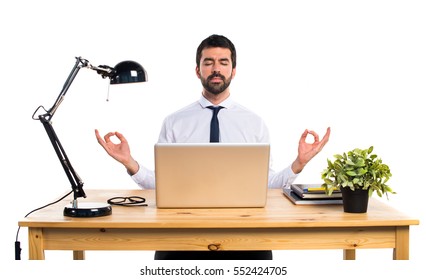 Businessman In His Office In Zen Position