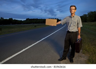 Businessman hitchhiking to work