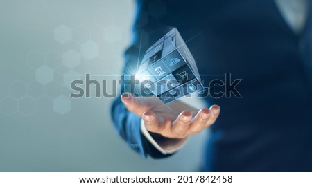 Businessman hold abstract square box cubic of business, Financial and banking concept, Digital marketing, Network and social media. Business symbols.