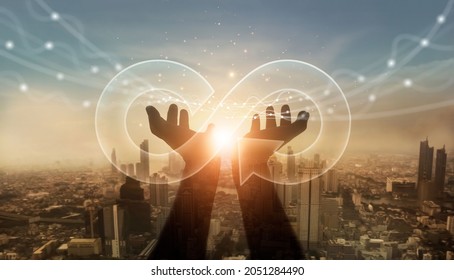 Businessman hold circular economy icon. Sustainable strategy approach to eliminate waste and pollution for future growth of business and environment, design to reuse and renewable material resources
 - Shutterstock ID 2051284490