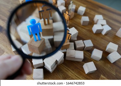 Businessman hold in hand magnifying glass. Look at silhouette of blue toy man. Lgbtq people search career concept. - Shutterstock ID 1646742853