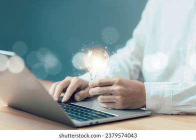 businessman hold light bulb technology digital energy electricity. concept of idea creative new, leadership genius is visionary, strategy, knowledge, expertise, and solutions in business - Shutterstock ID 2379574043