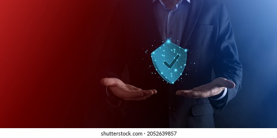 Businessman Hold Low Poly Polygon Shield With A Tick Icon.Secure Access System Concept.Business Financial Warranty For Investment.antivirus Concept.Technology Security.Protection Network,safe Data