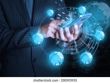 Businessman hold mobile phone social and internet connectivity concept - Shutterstock ID 330593933