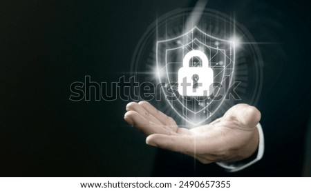 Businessman hold shield icon. Data protection and insurance Business security concepts.