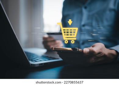 Businessman hold smartphone with online shopping concept, marketplace website with virtual interface of online Shopping cart part of the network, Online shopping business with selecting shopping cart. - Powered by Shutterstock