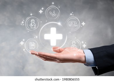 Businessman Hold Virtual Plus Medical Network Connection Icons. Covid-19 Pandemic Develop People Awareness And Spread Attention On Their Healthcare.Doctor,document,medicine,ambulance,patient Icon