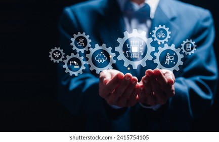 Businessman hold virtual Supply chain icons by artificial intelligence technology for AI in logistics and supply chain management concept. More accurate, reliable and cost-effective operation. - Powered by Shutterstock