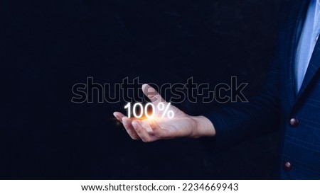 Businessman holding with 100 percentage sign, monetary growth, interest rate increase, inflation concept, Interest rate financial and mortgage rates concept.