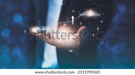 Businessman holding arrow up statics stock graph and chart background concept growth business investment stock market strategy development finance corporate future growth plan economy digital analysis