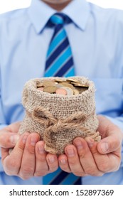 Businessman Holding A Bag Of Euro Coins - Community Funding Concept