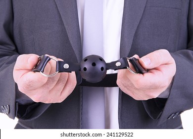 Businessman Holding Ball Gag