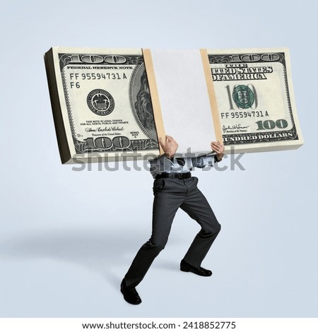 Businessman holding big bundle of money