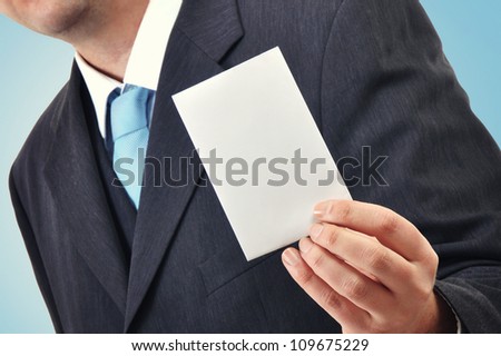 Businessman is holding a blank business card, cpy space for your design Stock photo © 