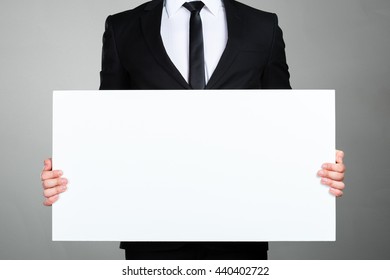 Businessman Holding Blank Picture Frame 