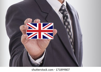 Businessman holding a business card with UK flag - Shutterstock ID 171899807