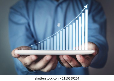Businessman holding business graph. Finance concept - Shutterstock ID 1110839234