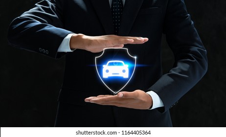  businessman holding car icon.Car Care and maintenance concept. - Powered by Shutterstock