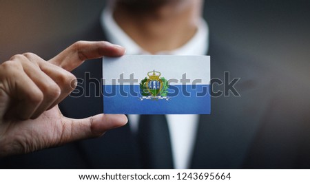 Businessman Holding Card of San Marino Flag 