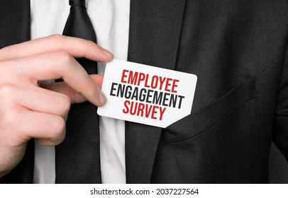 Businessman Holding A Card With Text Employee Engagement Survey