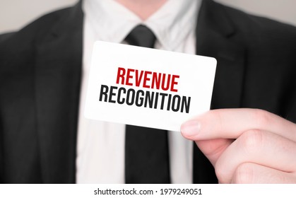 Businessman Holding A Card With Text Revenue Recognition