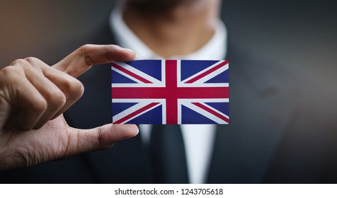 Businessman Holding Card of United Kingdom Flag - Shutterstock ID 1243705618