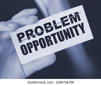 Businessman Holding A Card With Word Problem Strikeout And Opportunity. Problem Turns Into Opportunity. Business Crisis Management Concept.