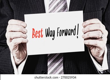 A Businessman Holding A Card With The Words, Keep Best Way Forward.